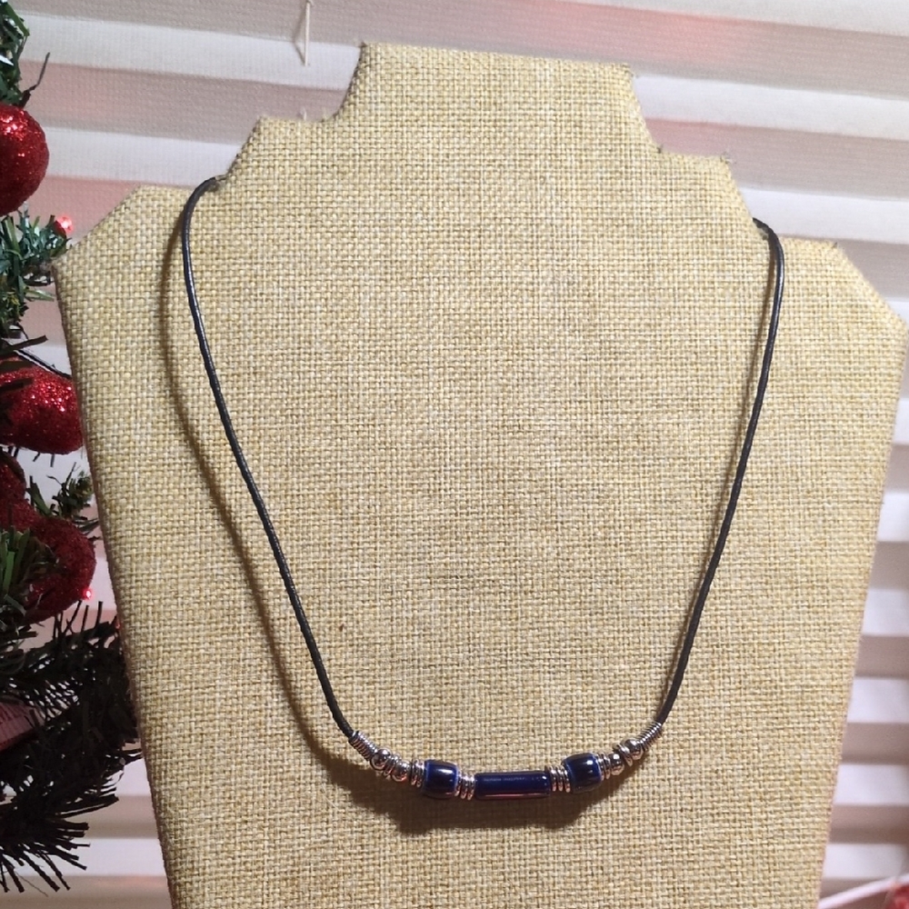 black leather cord necklace with blue pipe beads and silver-tone metal accents